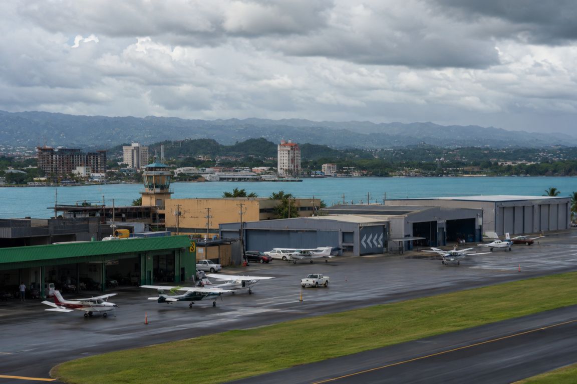 View of San Juan's Isla Grande Airport with small aircraft on the tarmac before a Culebra island tour with Culebra Tours